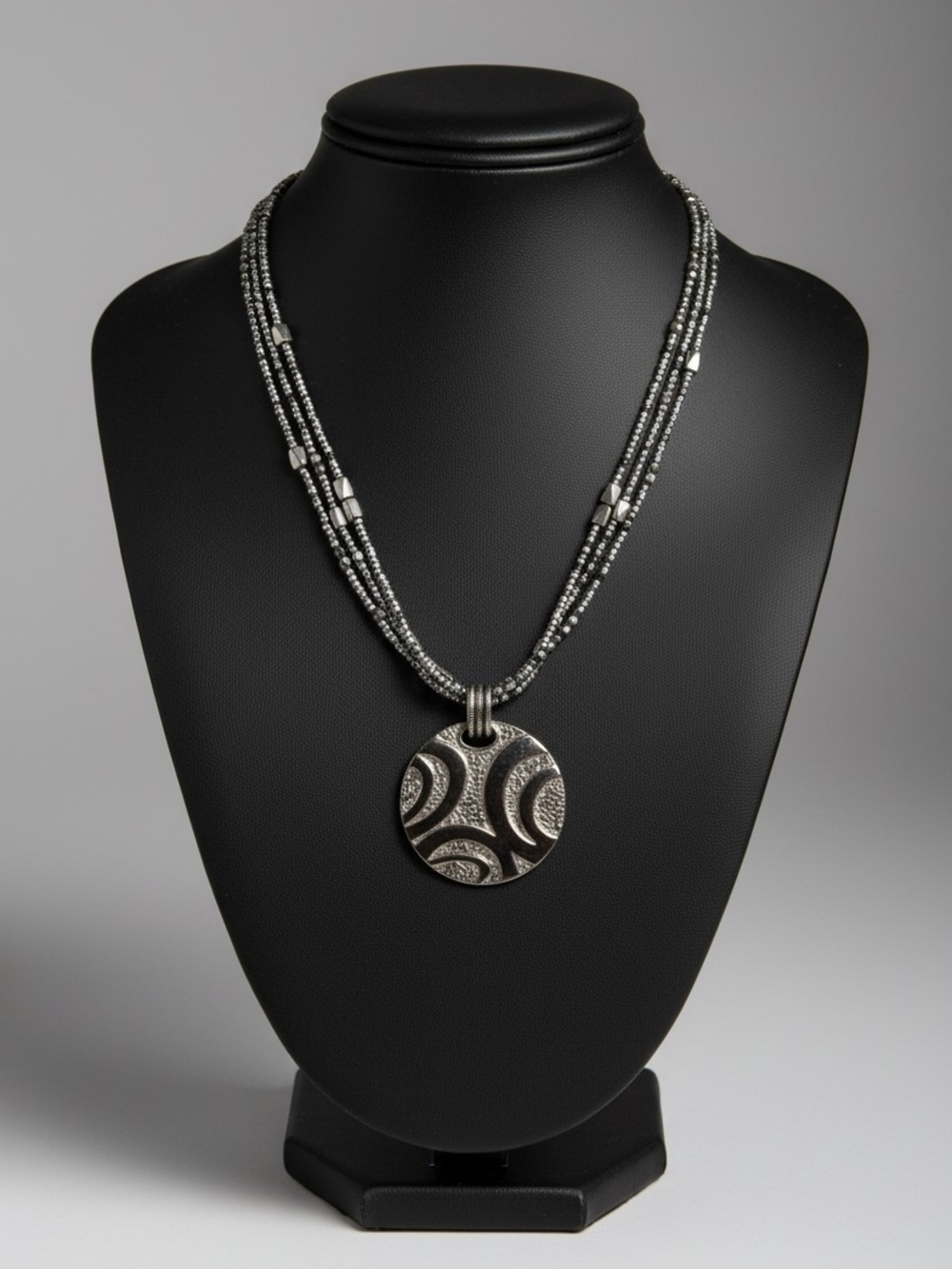 Silver Multi-Strand Beaded Necklace with Decorative Round Pendant